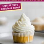 gluten free vanilla cupcake on a plate with vanilla frosting piped on top