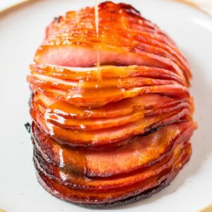 meat fork in slices of glazed ham