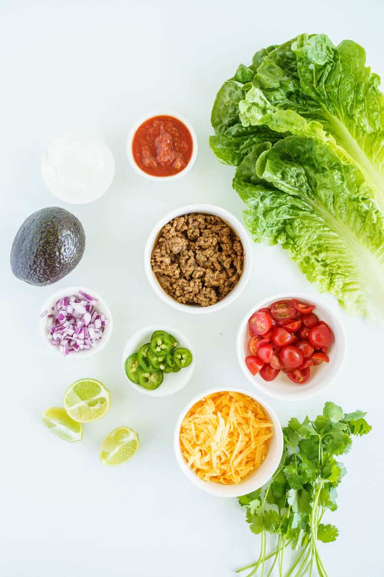 Bowls of Taco Meat, Tomatoes, Cheese and the Other Taco Bowl Ingredients on a Counter