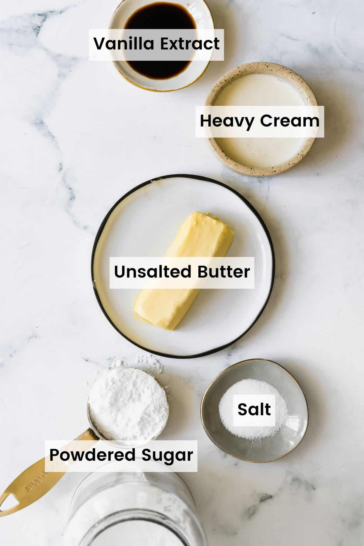 Softened Butter, Vanilla Extract, Salt and the Other Frosting Ingredients on a Countertop with label overlaid on the image.