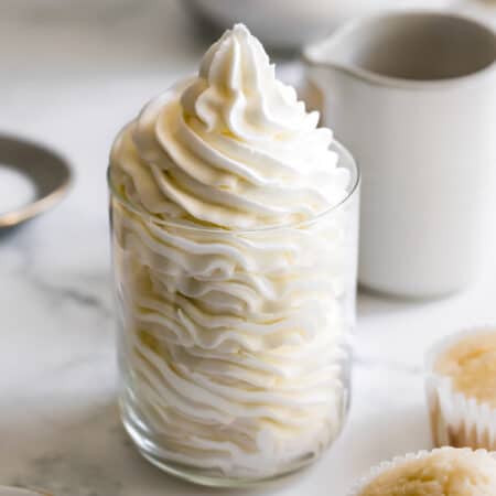A Glass Filled with Fluffy Vanilla Buttercream Frosting.