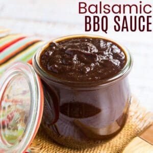 glass jelly jar filled with barbeque sauce on a piece of burlap