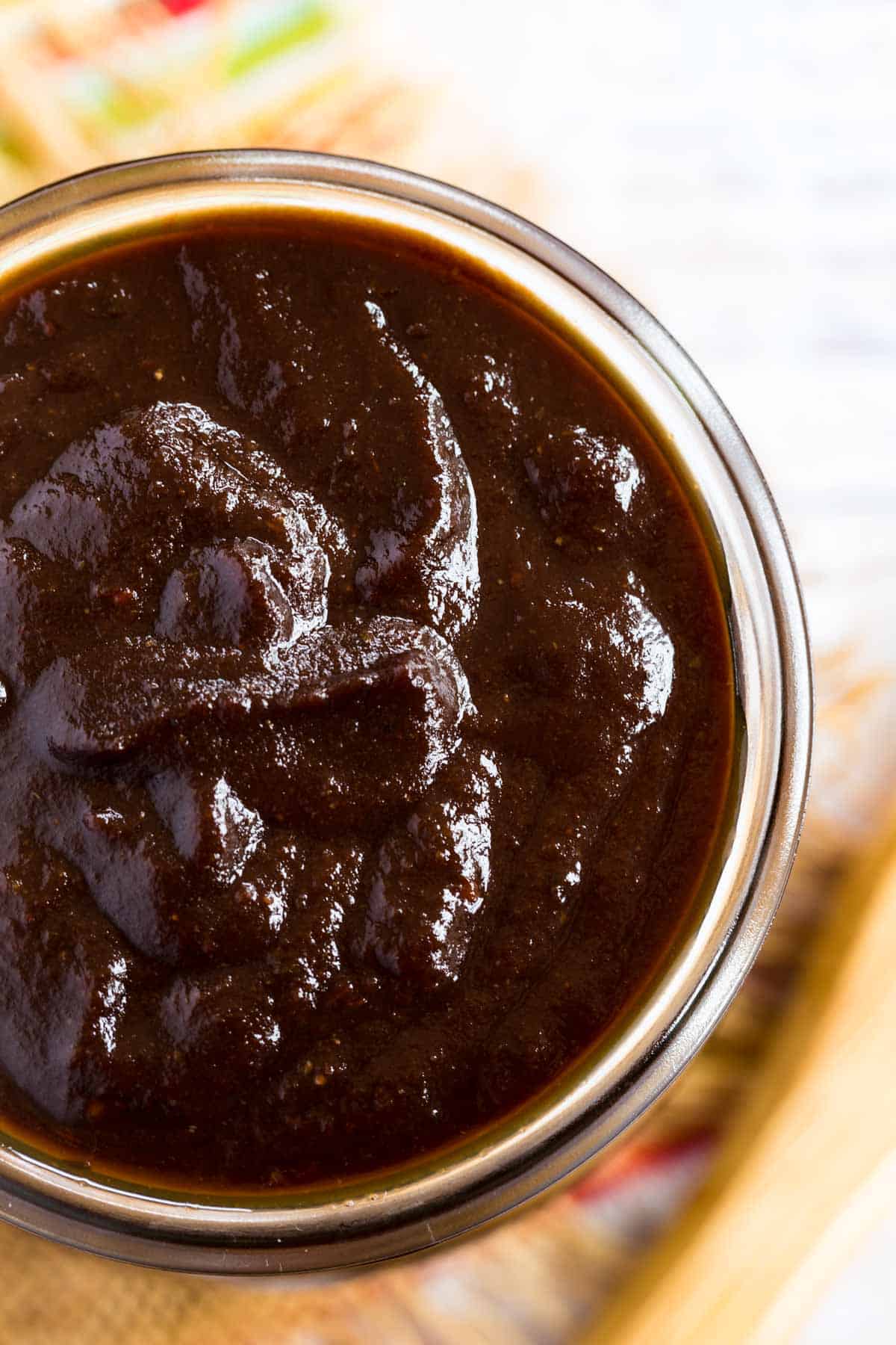 top of a glass jar filled to the top with barbecue sauce