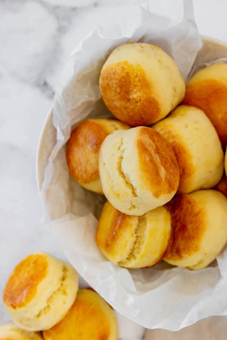 A Bowl Full of Gluten-Free Biscuits on a Marble Countertop