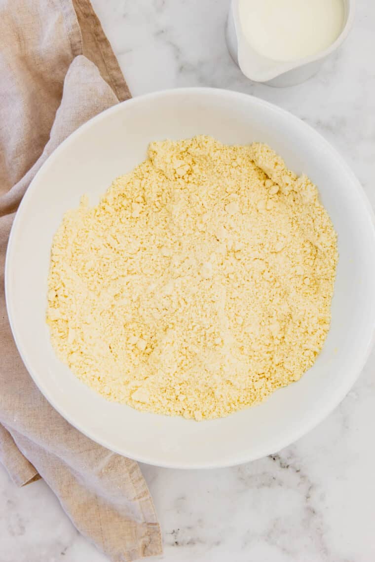 A Bowl Containing the Combined Dry Ingredients and Cold Butter for Gluten-Free Biscuits