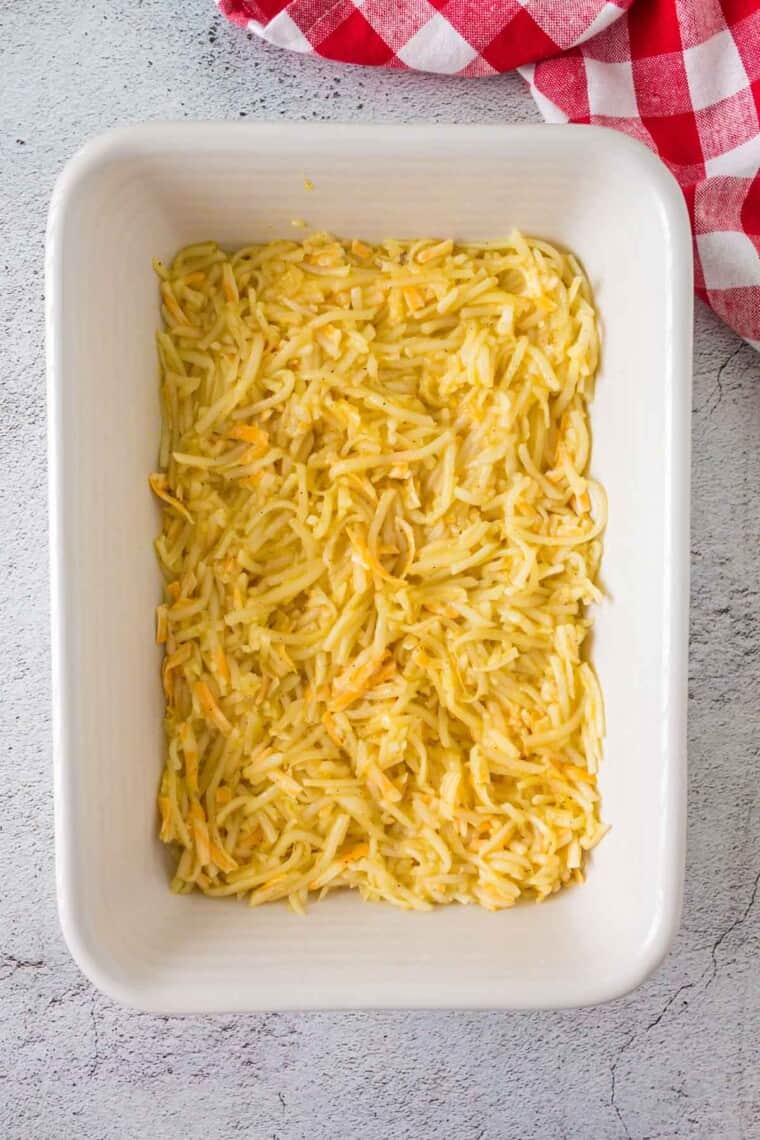 unbaked hash brown casserole in a baking dish