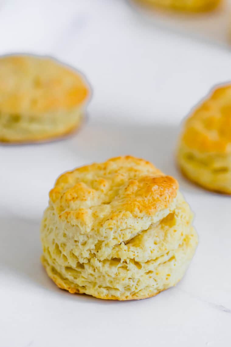 A Golden Gluten-Free Sweet Biscuit on a White Marble Countertop