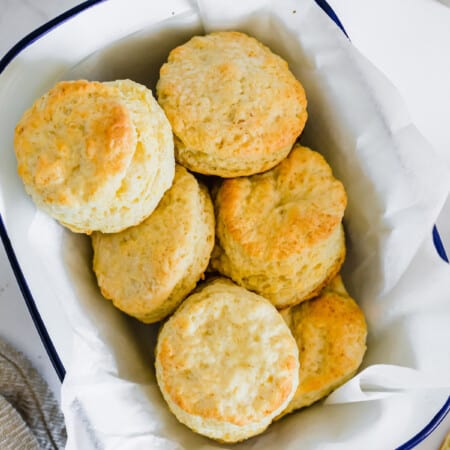 Biscuits in a parchment-lined bowl.