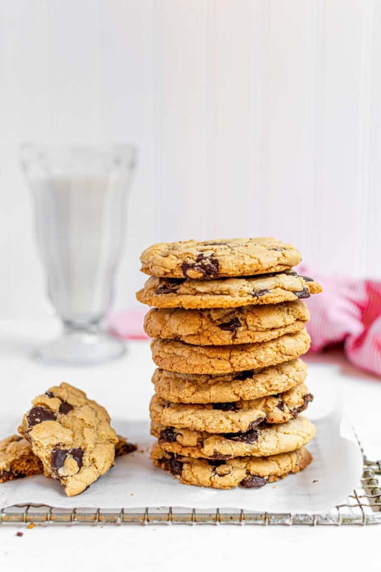 stack of chocolate chip cookies and one broken in half next to it