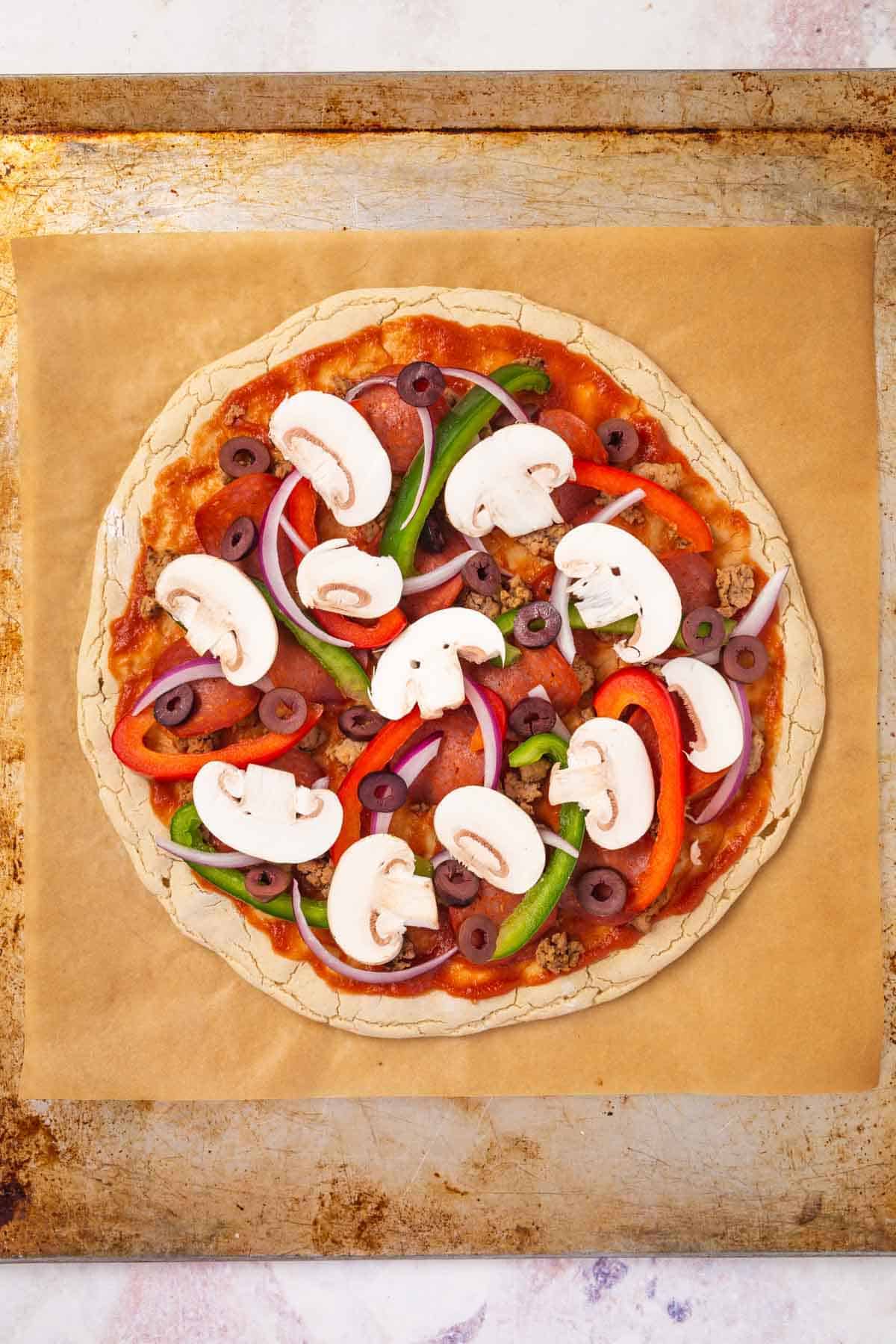 Mushrooms, Olives and the Other Veggies on Top of the Pepperoni, Sausage, Sauce and Gluten-Free Crust