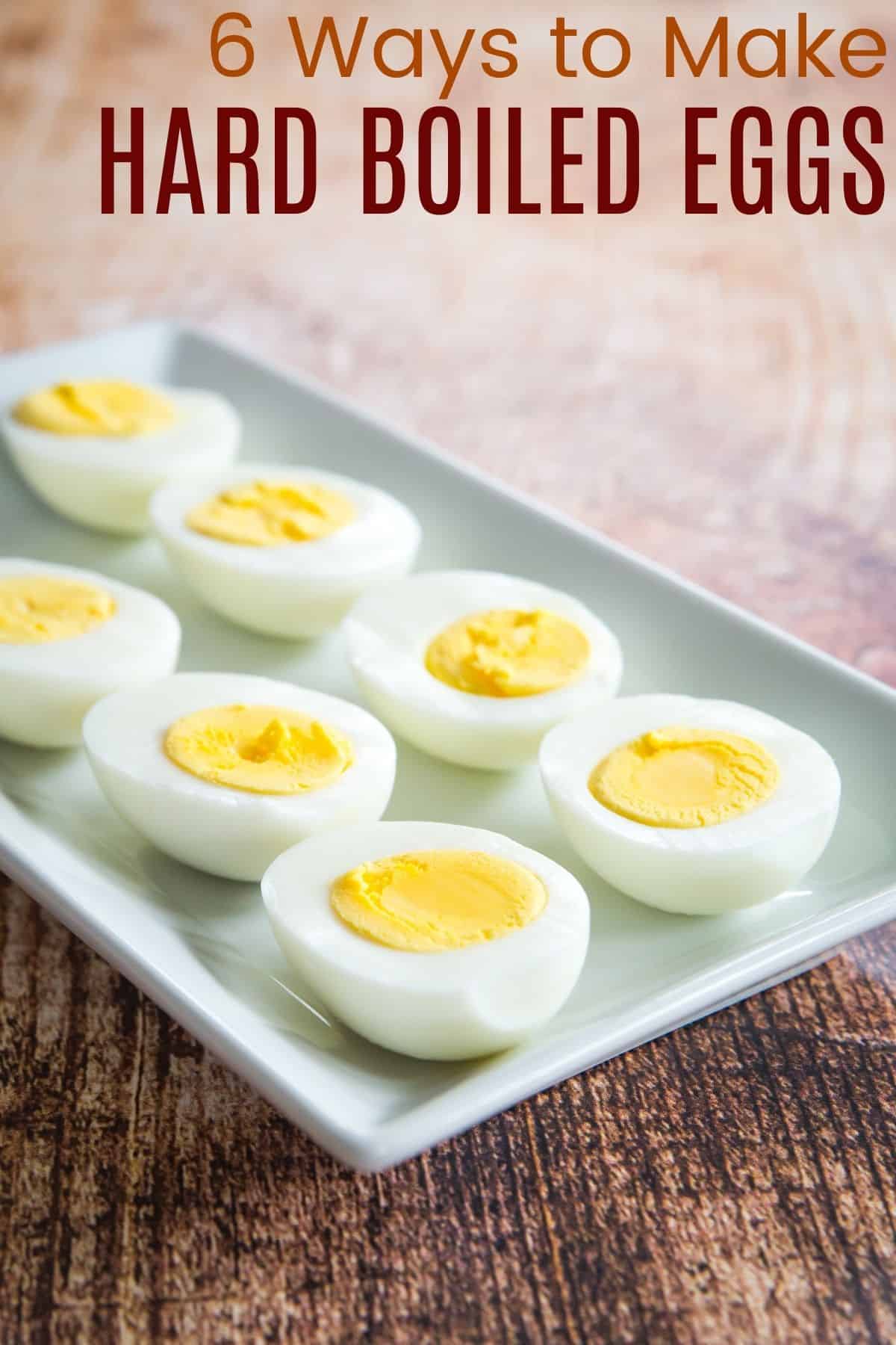 hard boiled eggs cut in half and lined up on a rectangle serving plate