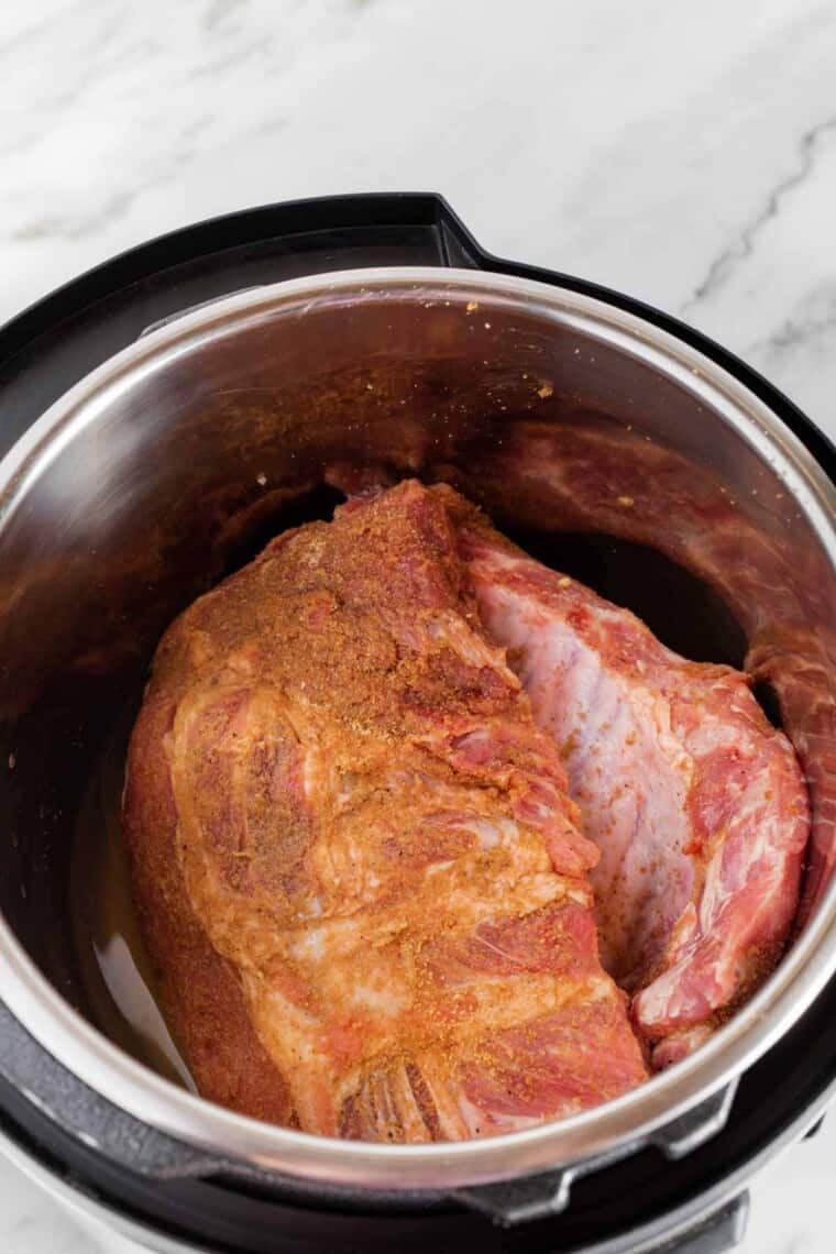 Uncooked, Fully Seasoned Pork Ribs Inside of an Instant Pot