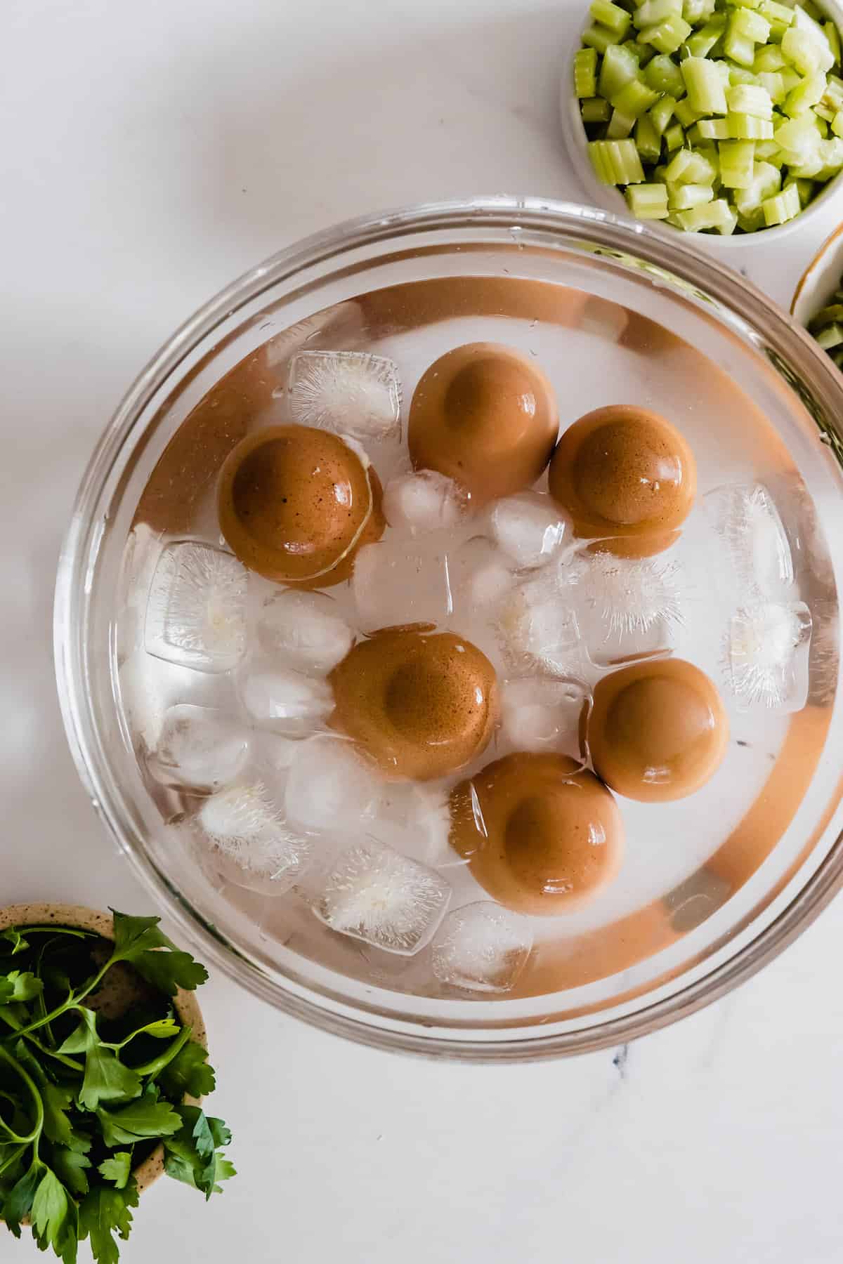 Six Hard-Boiled Eggs Sitting in a Bowl of Ice Water