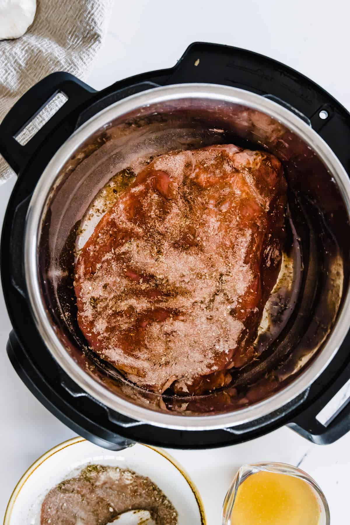 A Boneless Shoulder of Pulled Pork in an Instant Pot that has Just Been Rubbed with the Spice Rub