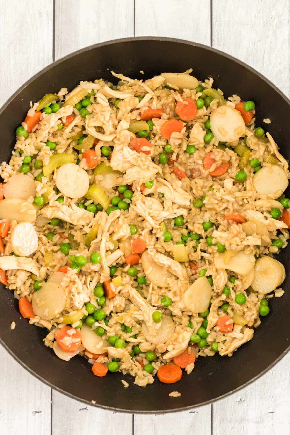 large cast iron skillet with chicken fried rice