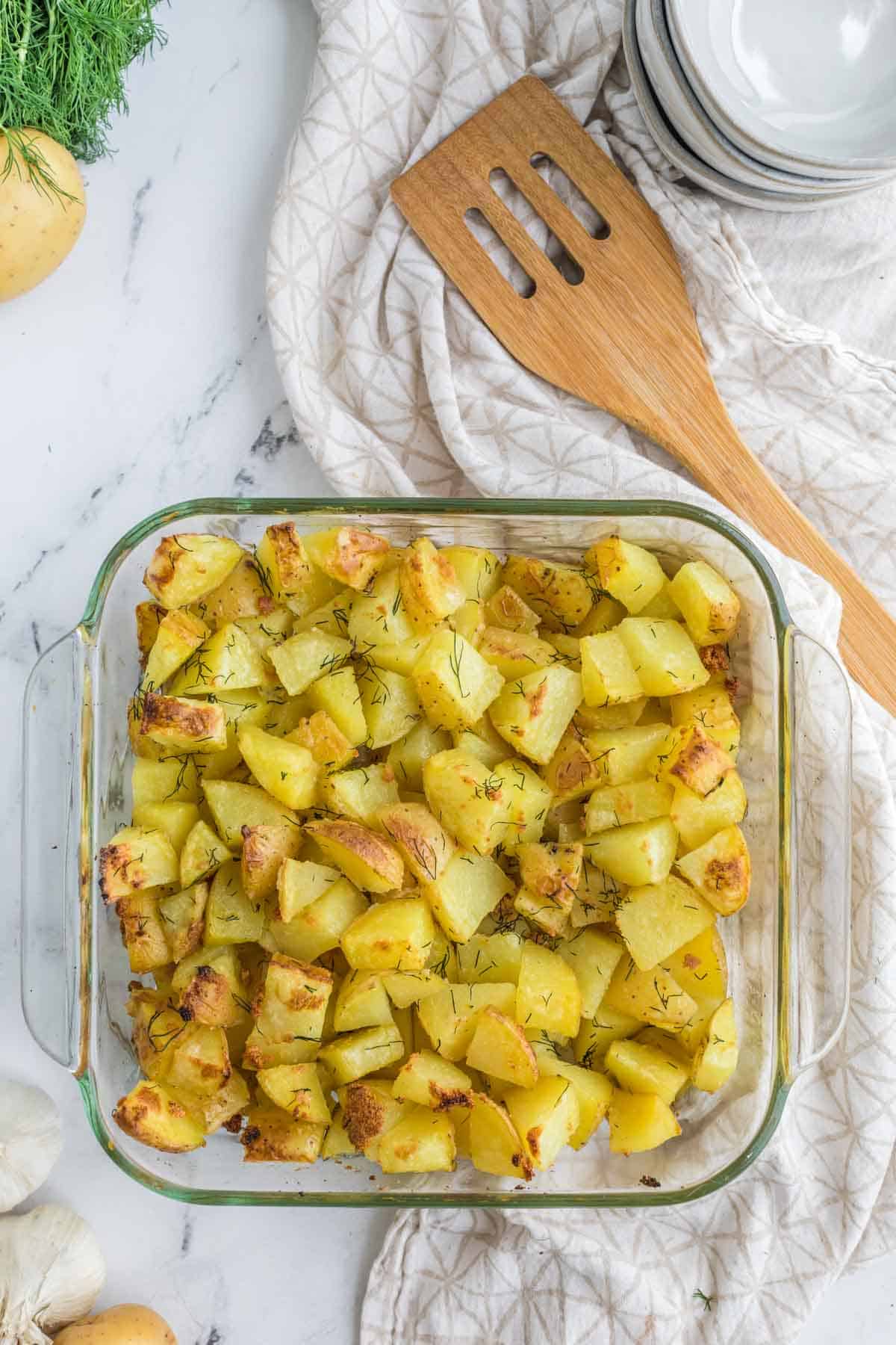 Crispy baked hash browns in a glass baking dish.