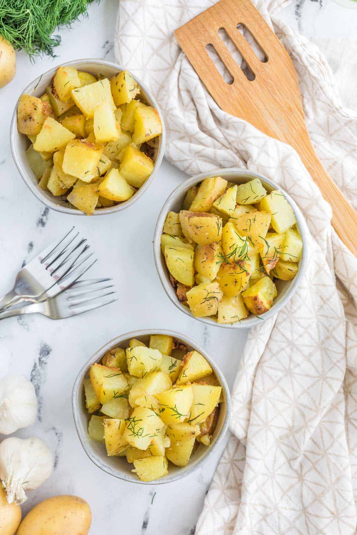 three bowls of dill hash brown potatoes