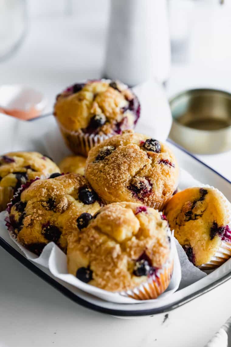 A White Serving Platter with a Blue Rim Containing Gluten-Free Blueberry Muffins