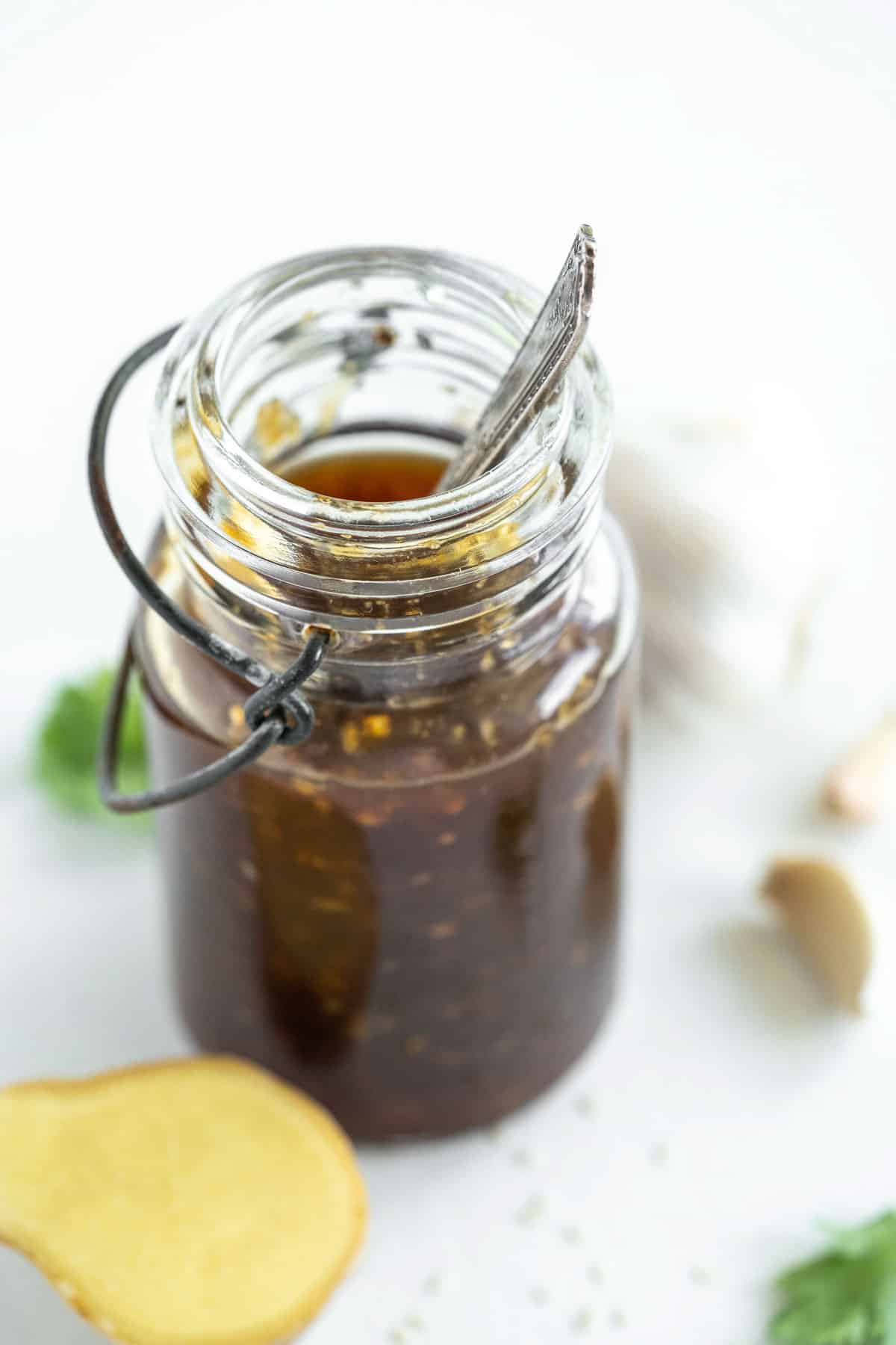 45 degree overhead of a jar of gluten free teriyaki sauce with ginger