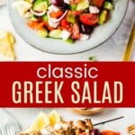 spoon picking up greek salad from a serving bowl and some of it in a plate with chicken kabobs and pita