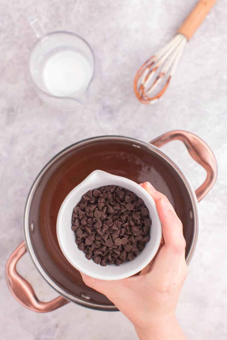 adding the chocolate chips to the pot