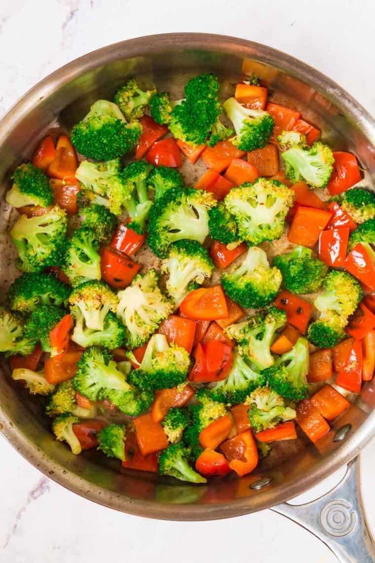 sauteed broccoli and red pepper in a skillet