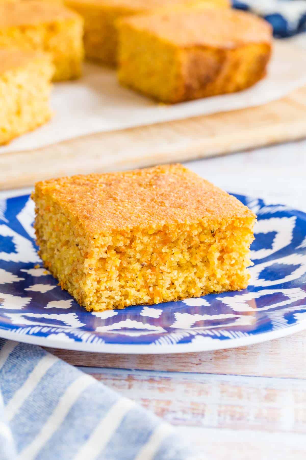 one square of cornbread on a blue and white plate