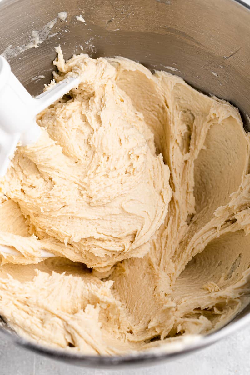 bread dough in a stand mixer with a paddle attachemnt