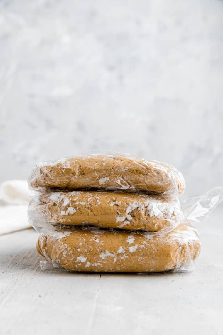 three pieces of graham cracker dough wrapped in plastic