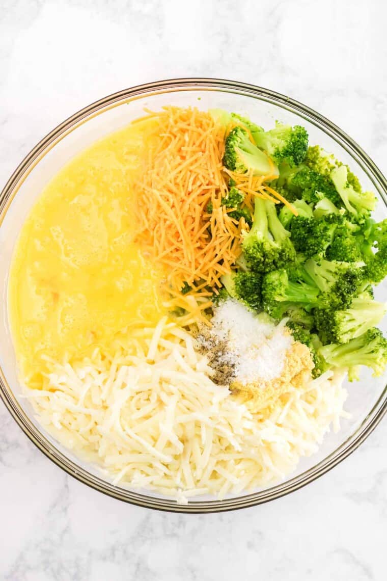 beaten eggs, shredded potatoes, cooked broccoli, shredded cheese, salt, pepper, and dry mustard in a glass bowl