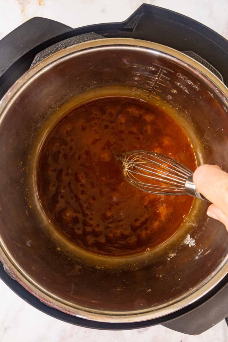 whisking teriyaki sauce in the instant pot