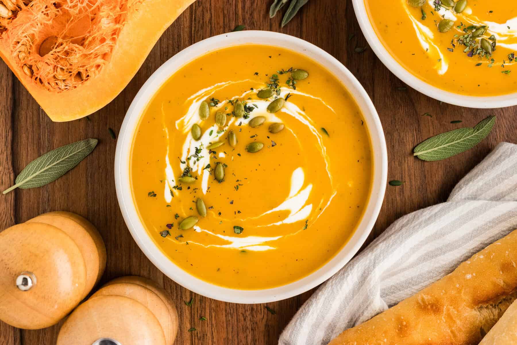 Overhead view of a bowl of butternut squash soup.