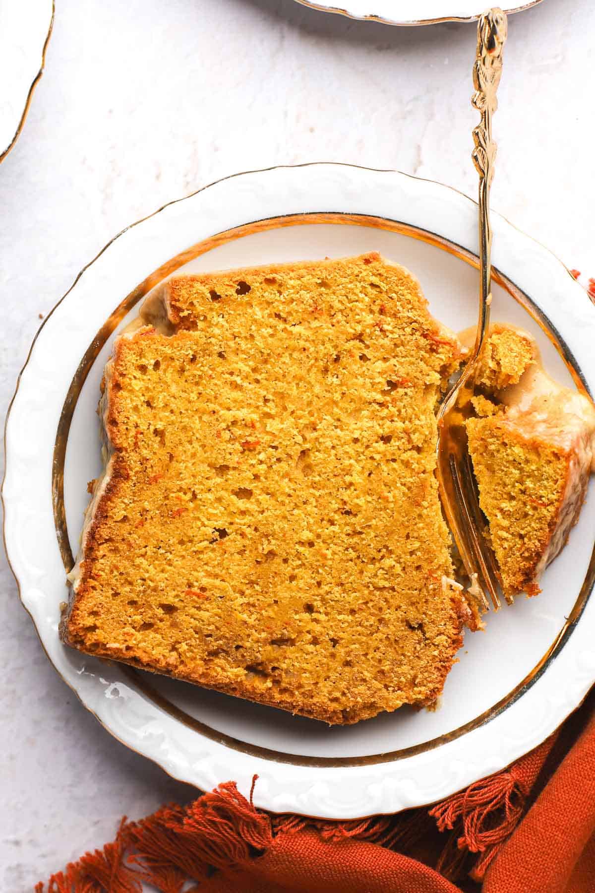 pouring maple glaze on gluten-free pumpkin bread slices