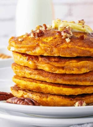 close up on a stack of gluten free pumpkin pancakes.