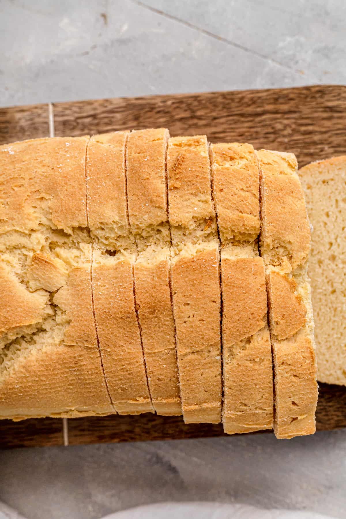 slices of gluten free sandwich loaf on a wooden board