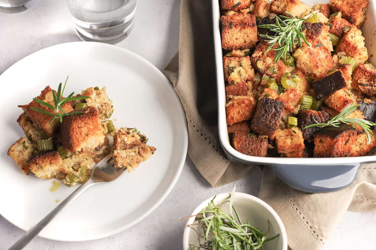 baking dish and serving plate of gluten-free thanksgiving stuffing