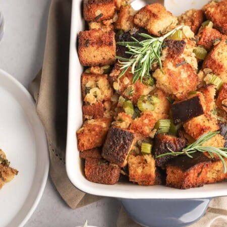 gluten free stuffing in a baking pan and some on a plate