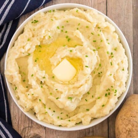bowl of mashed potatoes with butter and chives