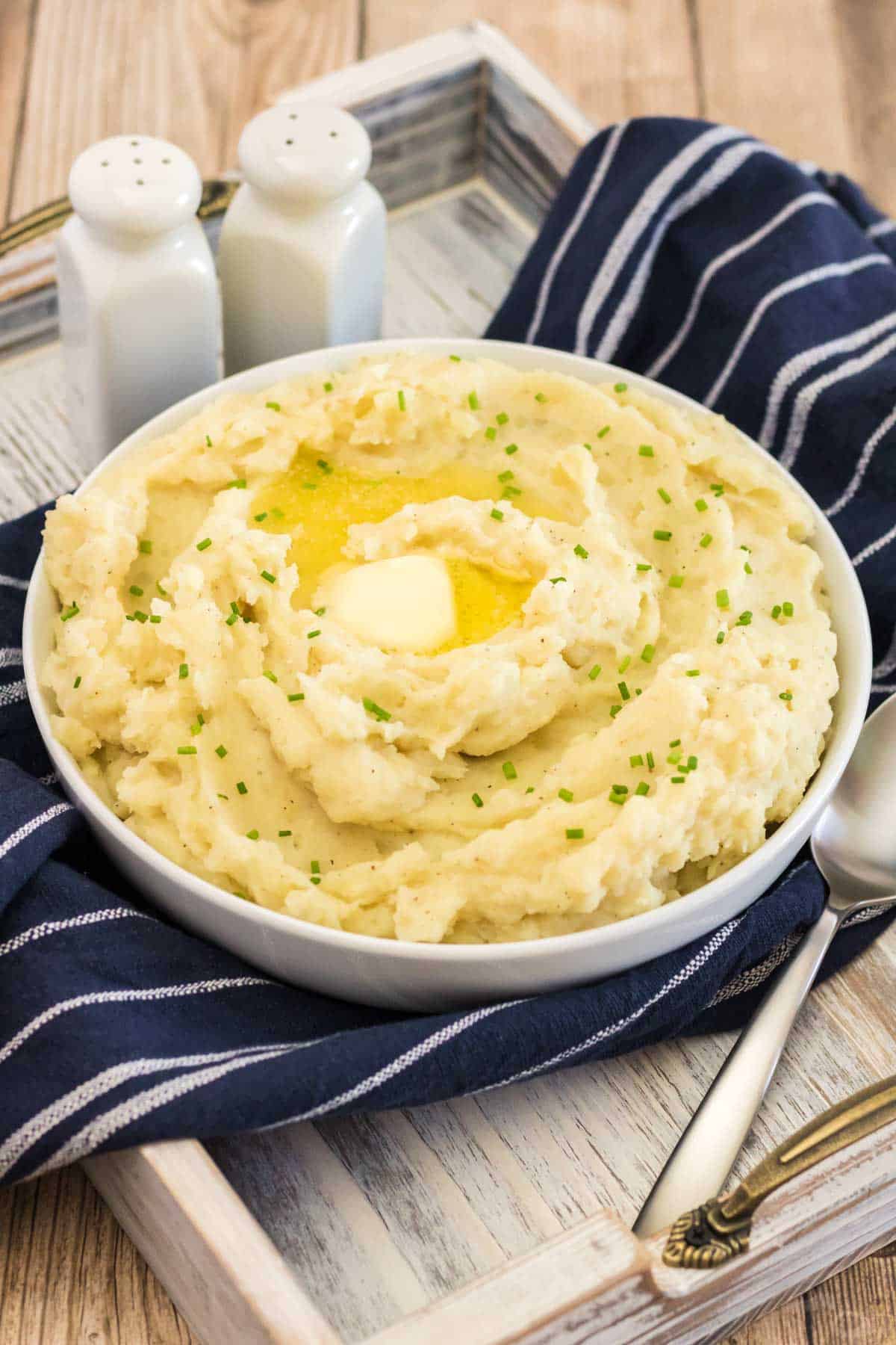 buttery mashed potaoes on a blue dish towel