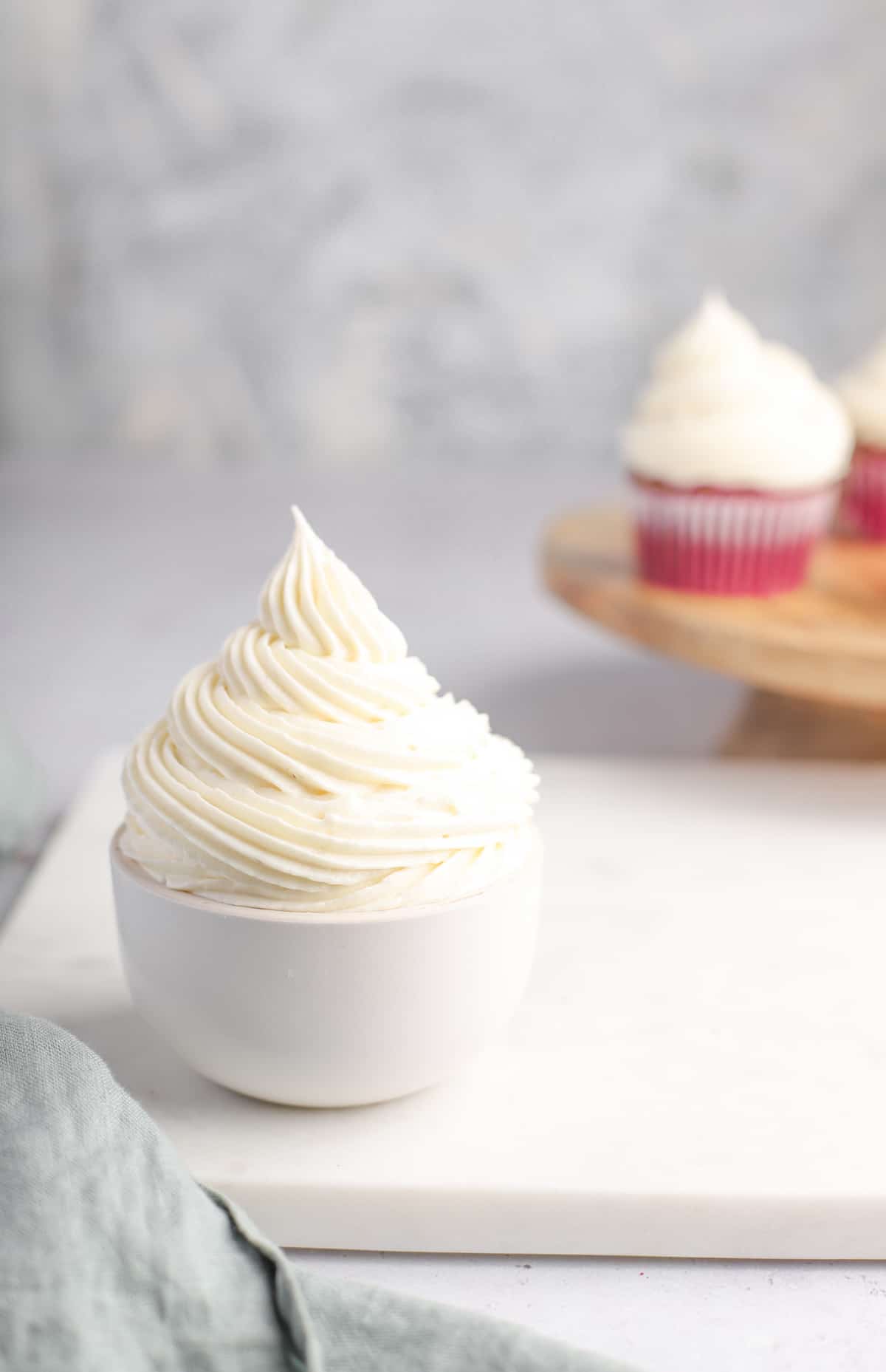 white bowl filled with vanilla cream cheese frosting