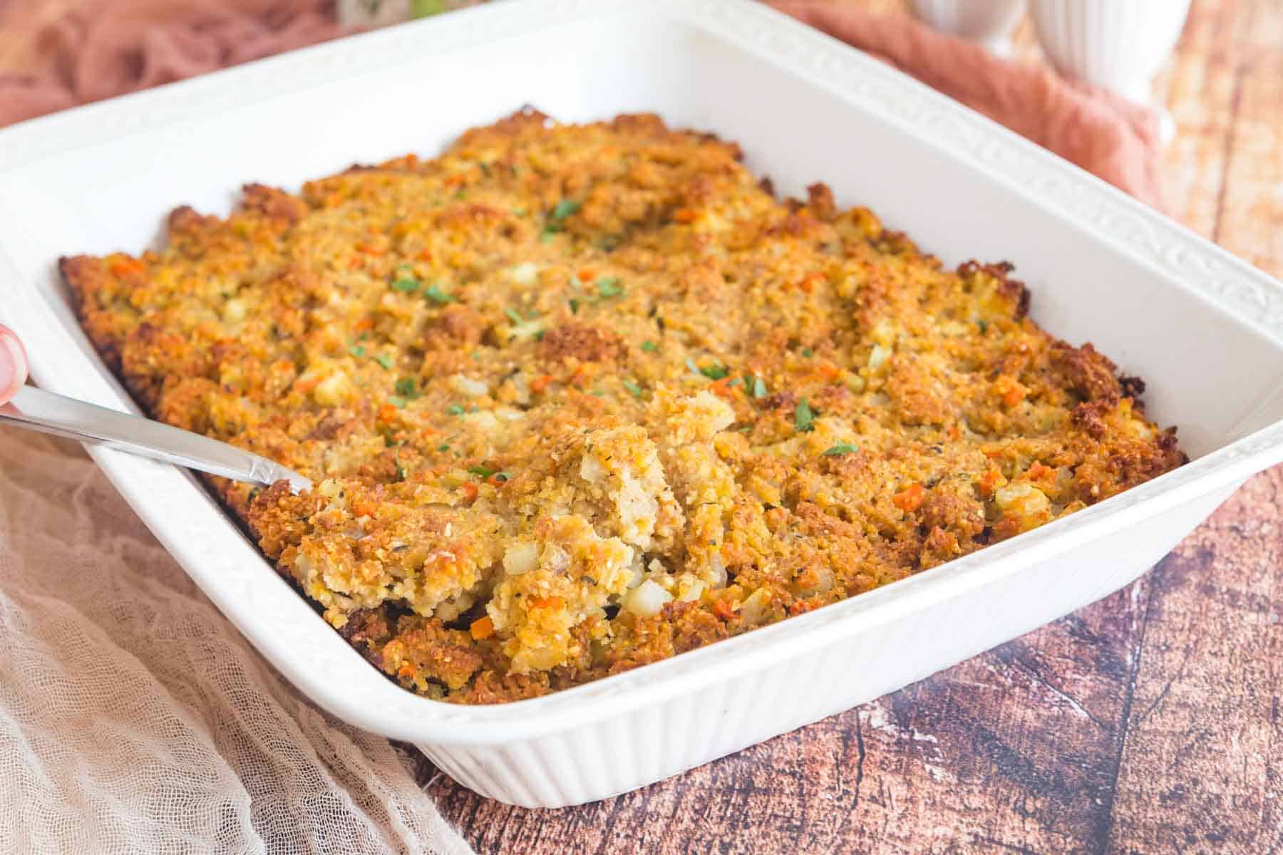 white baking dish of gluten free cornbread stuffing