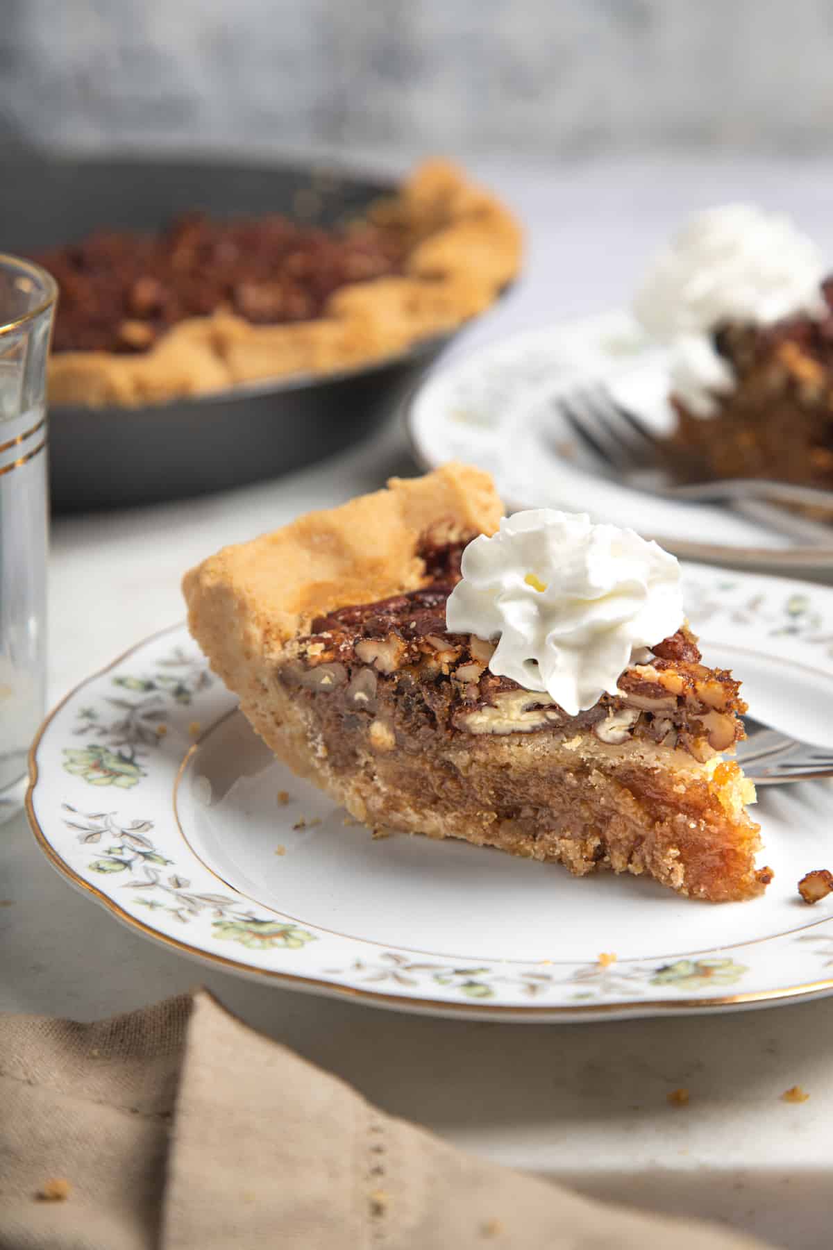slice of pecan pie with whipped cream