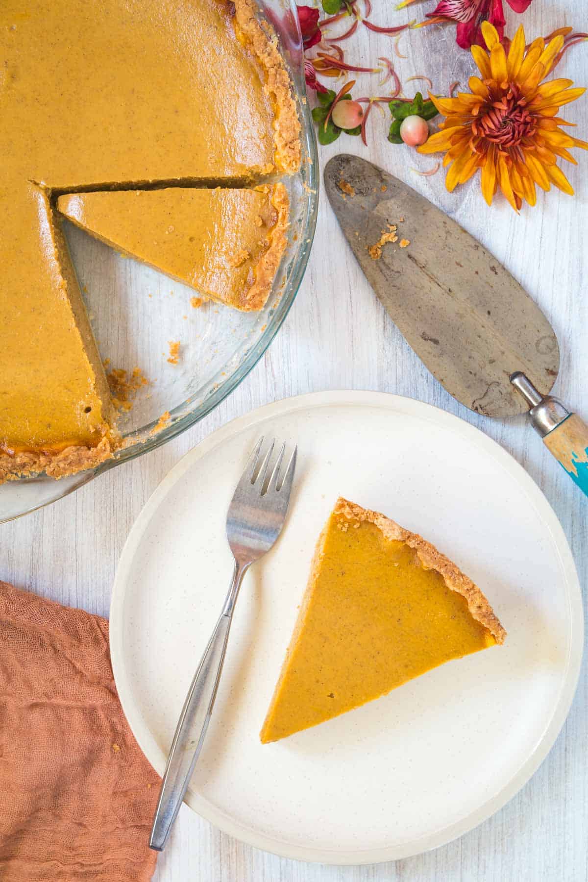 slice of gluten free pumpkin pie from a whole pie