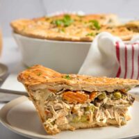 A thick slice of chicken pot pie on a plate.