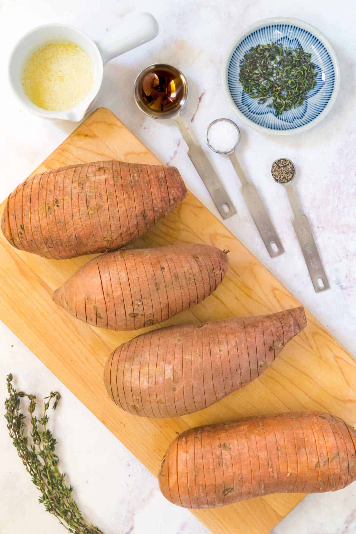 sliced sweet potatoes on a cutting board