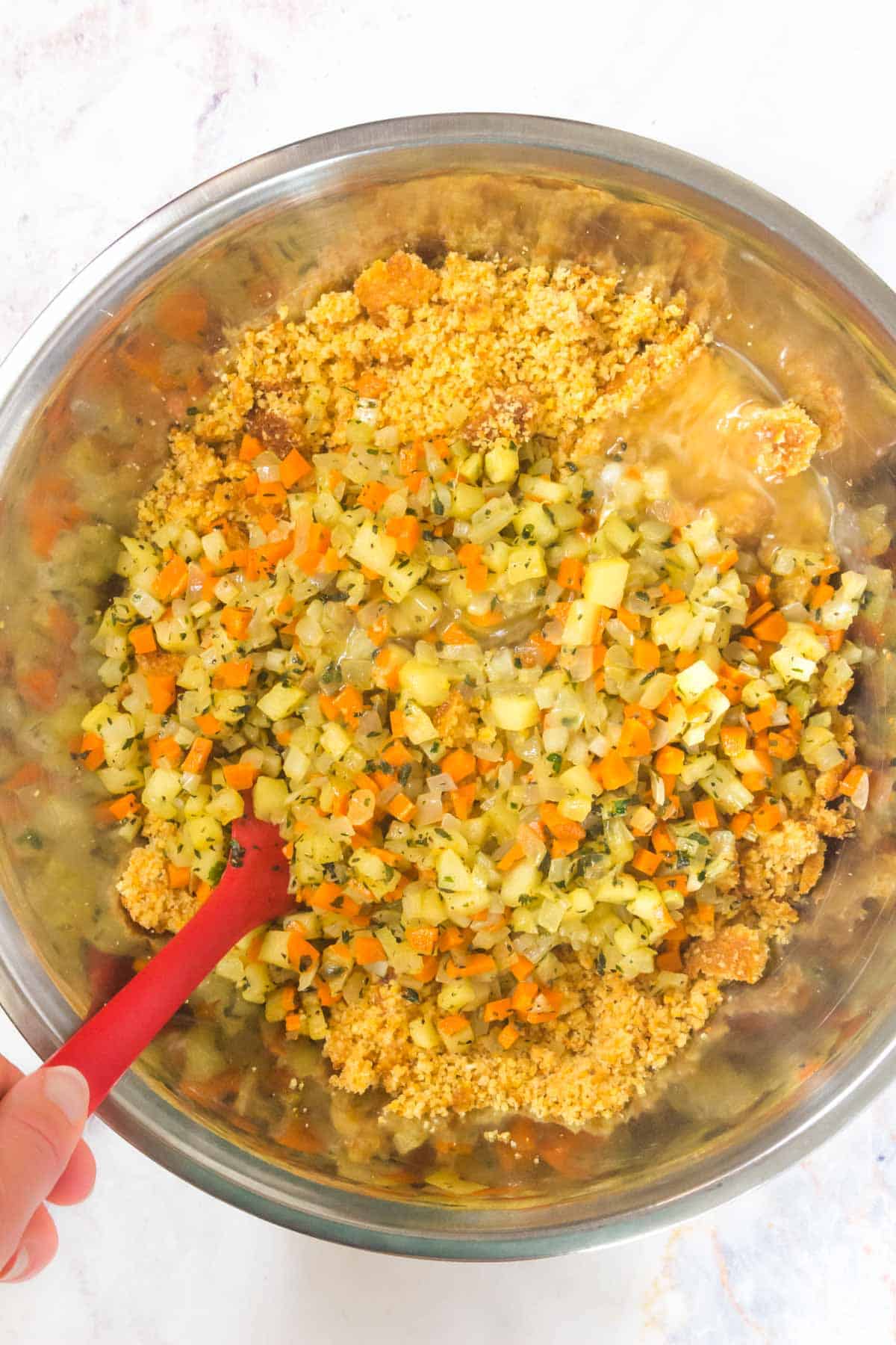 mixing stuffing in a metal bowl