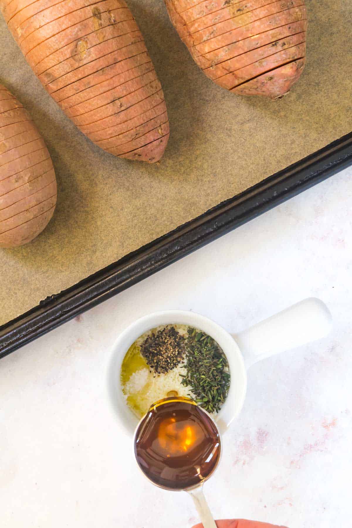 mixing honey butter next to sweet potatoes