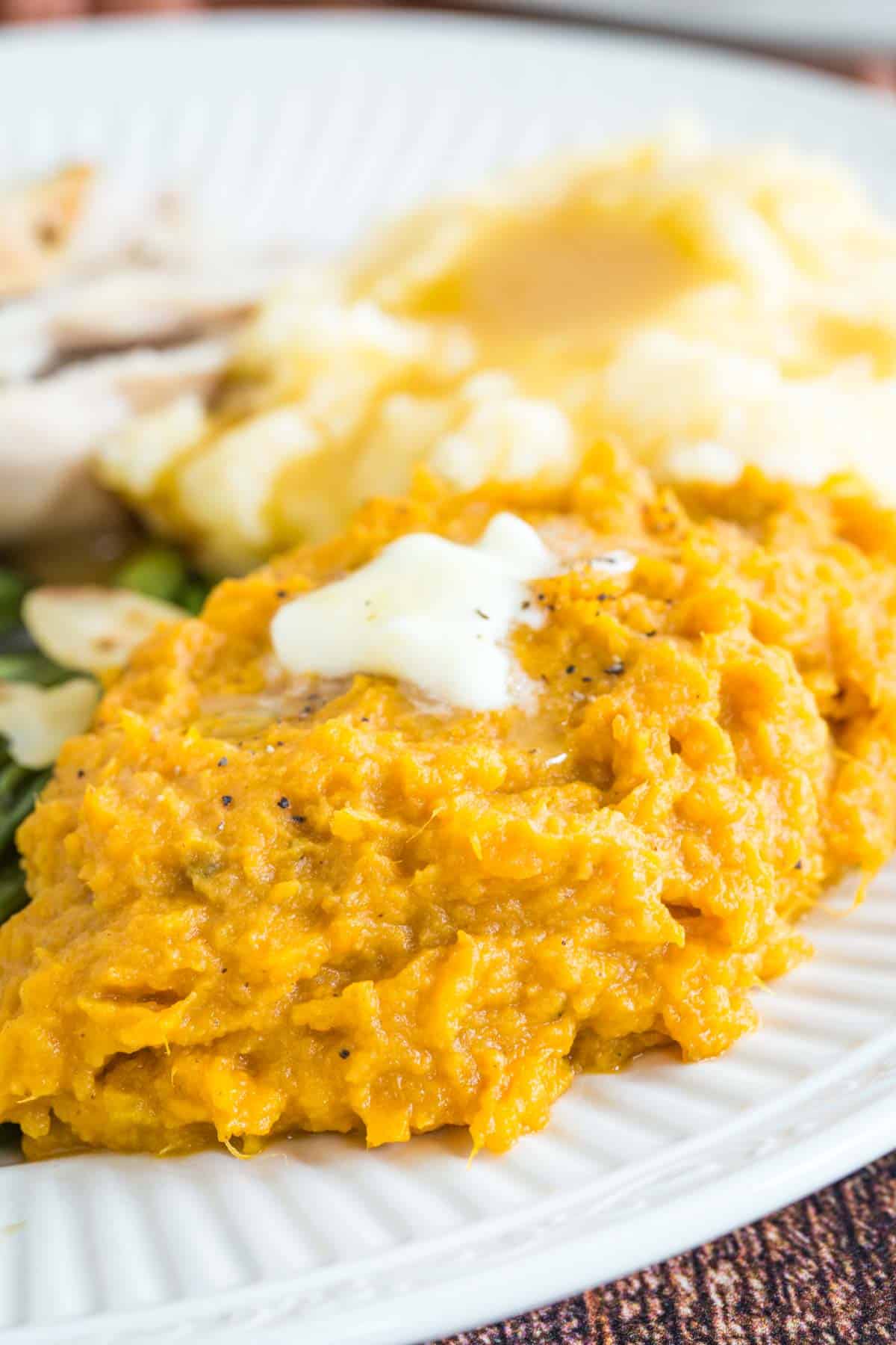 plate of mashed sweet potatoes with butter