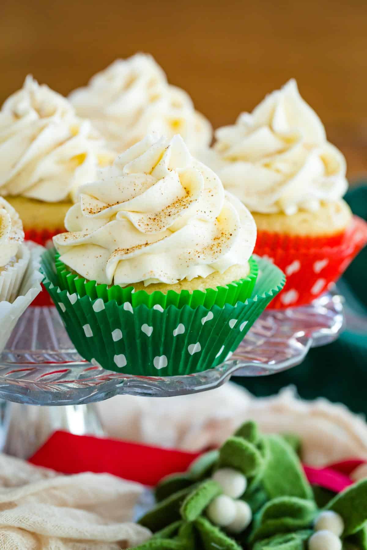 gluten free eggnog cupcakes on a cake plate