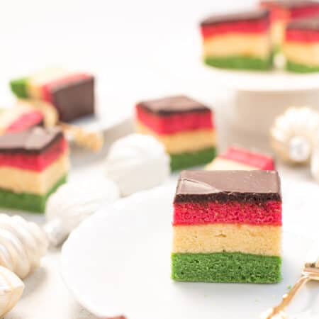 slices of rianbow gluten free cookies on white plates